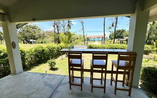 Titled Oceanview Home with Bodega Directly in Front of Waves